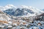 Discover this charming ski resort nestled amidst majestic snow-capped mountains.