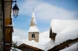 Experience the charm of a winter wonderland with this picturesque scene.