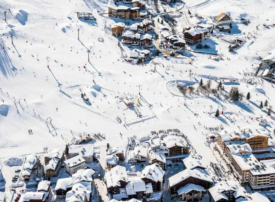 Experience the ultimate alpine lifestyle with this stunning ski resort property, offering direct access to pristine slopes and breathtaking mountain views.
