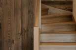 Experience rustic charm and modern elegance with this stunning wooden staircase and door.