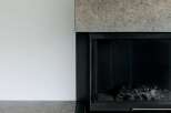 Experience modern living with this stunning fireplace featuring a sleek, minimalist design.