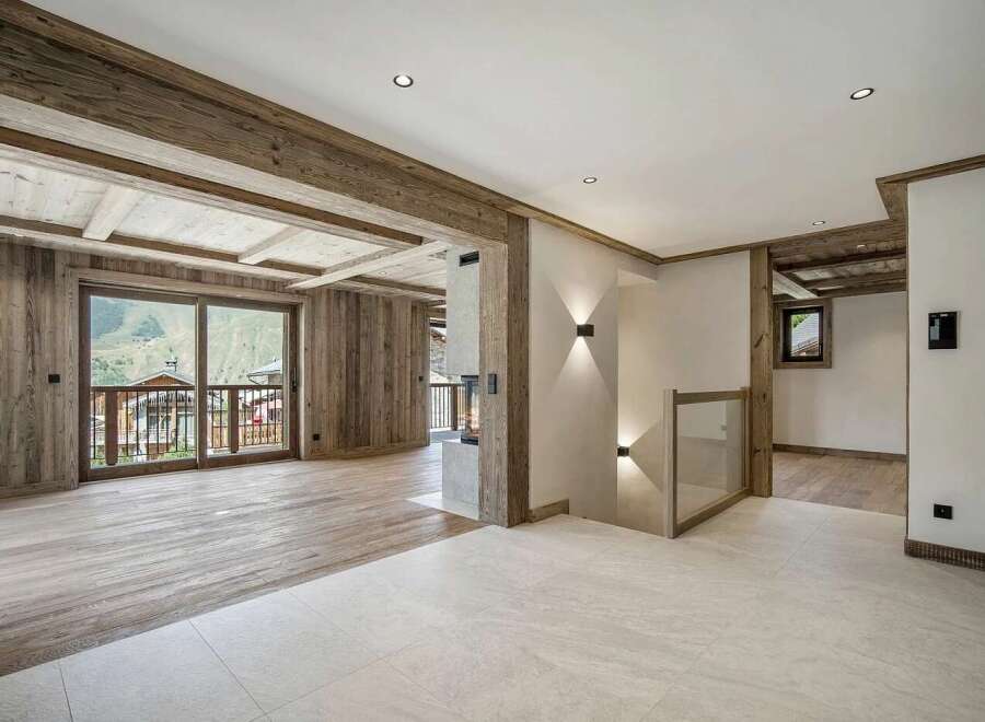 Experience rustic luxury in this stunning mountain chalet living space.