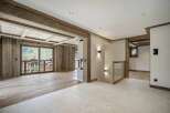 Experience rustic luxury in this stunning mountain chalet living space.