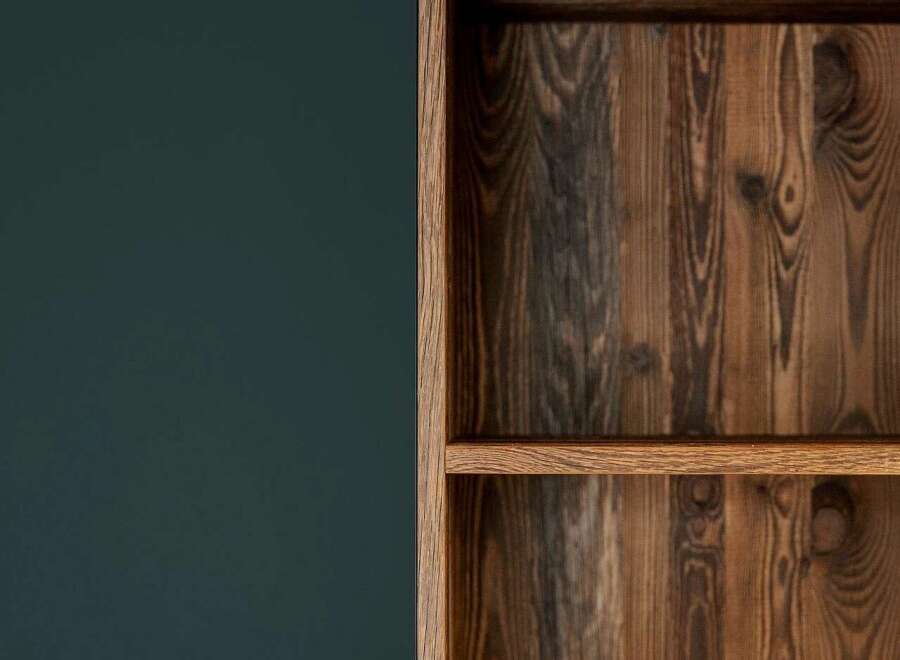 Discover the rustic charm of this home, featuring a beautifully crafted wooden bookshelf that adds warmth and character to any living space.