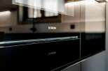 Experience modern luxury with this sleek Siemens built-in oven, featuring a seamless glass door and integrated controls.