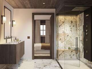 Experience luxury in this modern bathroom featuring a floating wood vanity with a marble countertop and sleek fixtures.