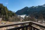 Experience breathtaking mountain views from this charming property, nestled amidst a serene alpine landscape.