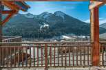 Experience breathtaking mountain views from this charming wooden balcony, perfect for enjoying your morning coffee or evening relaxation.
