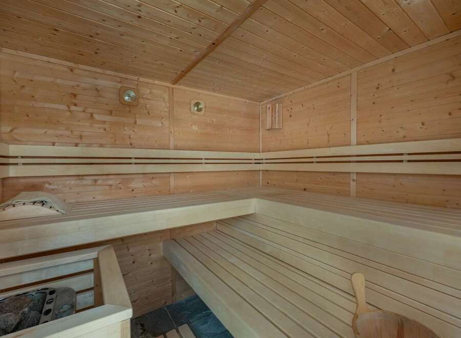 Experience ultimate relaxation in this beautifully crafted wooden sauna.