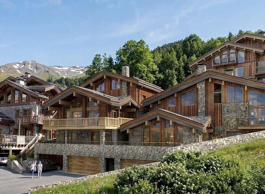 Experience luxury mountain living in this stunning chalet, featuring a harmonious blend of natural stone and warm wood architecture.
