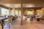 Experience luxurious mountain living in this stunning open-concept dining and living area.