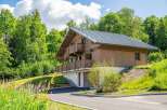 Experience serene living in this stunning wooden chalet nestled amidst lush greenery.