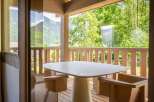 Enjoy your morning coffee or evening drinks on this charming balcony, complete with a stylish table and seating.