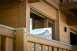 Experience the breathtaking mountain views from this charming wooden cabin.