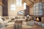 Experience luxury mountain living in this stunning living room, featuring a grand fireplace with intricate tilework and a cozy seating area perfect for gathering.