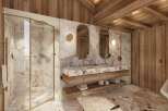 Experience luxury mountain living in this stunning bathroom featuring a spacious walk-in shower with marble walls and a sleek glass enclosure.