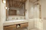 Experience luxury mountain living in this stunning bathroom featuring a double vanity with ample storage and a spacious walk-in shower with a modern gold showerhead.