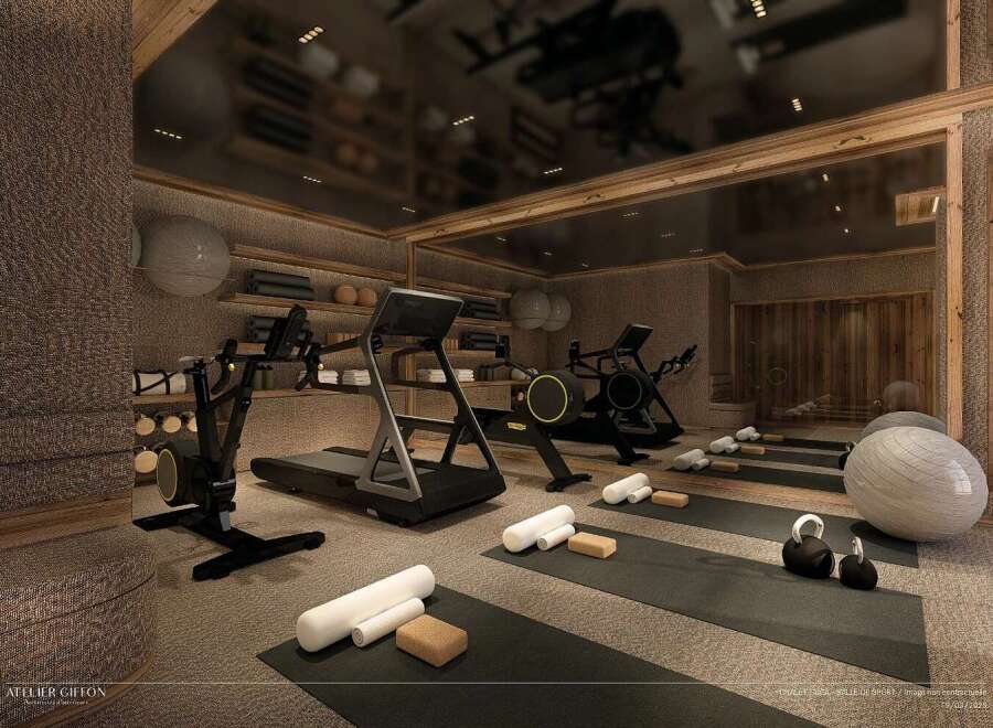 Experience ultimate wellness in this luxurious home gym, featuring state-of-the-art cardio equipment like treadmills and rowing machines, alongside yoga mats and weights for a complete workout.