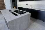 Experience modern luxury in this stunning kitchen featuring a sleek, minimalist design.