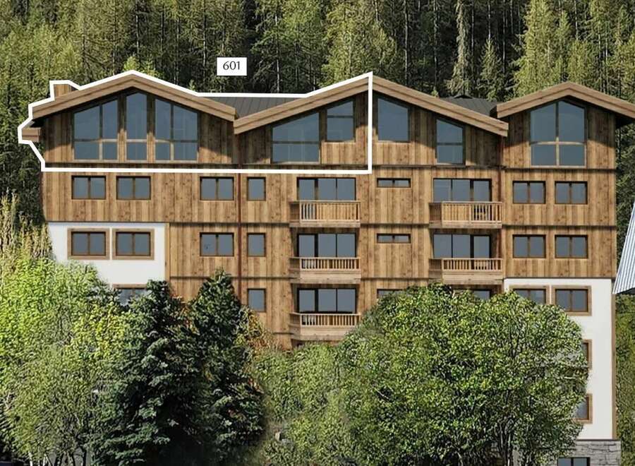 Discover this stunning multi-story wooden building nestled amidst a lush forest.
