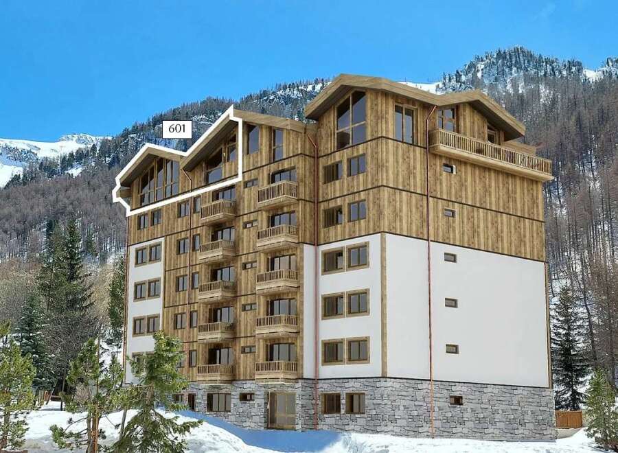 Experience luxury mountain living in this stunning property, featuring a modern wooden facade and expansive balconies perfect for enjoying breathtaking alpine views.