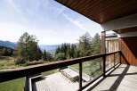 Enjoy breathtaking mountain views from this stunning balcony, perfect for outdoor dining or simply relaxing.