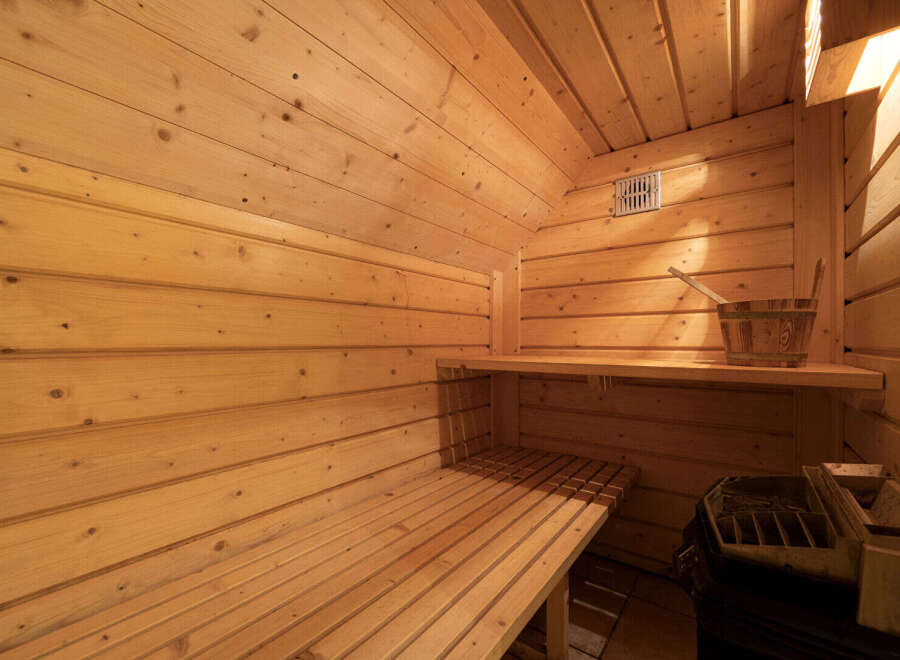 Experience ultimate relaxation in this beautifully crafted wooden sauna.