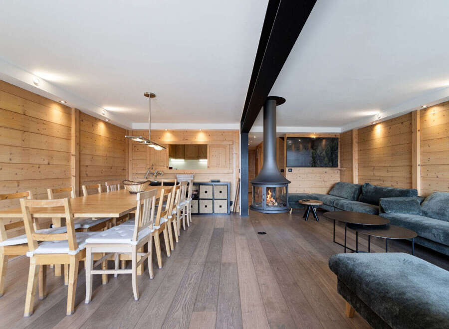 Experience rustic charm and modern comfort in this spacious open-plan living area.