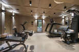 Elevate your fitness routine in this luxurious home gym, featuring state-of-the-art cardio equipment like treadmills and stationary bikes.