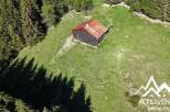 Discover this charming rustic cabin nestled in a serene mountain meadow, perfect for a peaceful retreat.