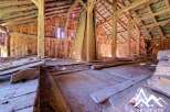 Discover the rustic charm of this unfinished barn, featuring exposed wooden beams and a spacious open floor plan.