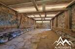 Discover the rustic charm of this unique property, featuring exposed stone walls and original wooden beams that evoke a sense of history and character.