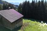 Discover this charming rustic barn nestled amidst the breathtaking scenery of the Alps.