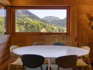 Experience breathtaking mountain views from this charming dining area, perfect for enjoying meals with a scenic backdrop.