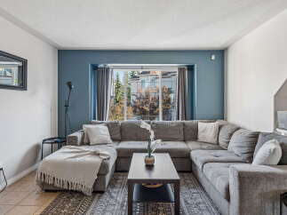 Step into this inviting living room, featuring a spacious sectional sofa perfect for family gatherings.
