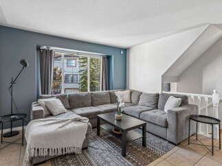Step into this inviting living room, featuring a spacious sectional sofa perfect for family gatherings.