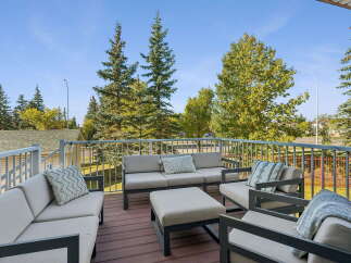Enjoy outdoor living on this spacious deck, perfect for entertaining or relaxing.