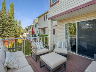 Enjoy outdoor living on this spacious deck, perfect for entertaining or relaxing.