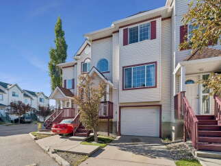 Discover this charming townhouse featuring a bright and airy interior with large windows and a spacious garage.