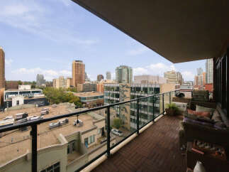 Enjoy breathtaking city views from this spacious balcony, perfect for entertaining or relaxing.
