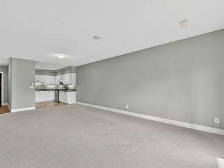 Step into this spacious open-concept living area, perfect for modern living and entertaining.