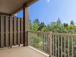 Enjoy the outdoors from this spacious balcony, perfect for relaxing or entertaining.