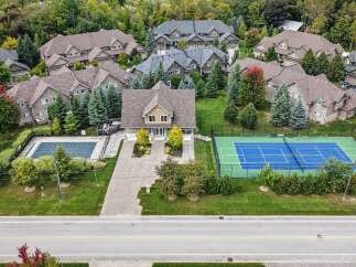 Experience luxury living in this stunning property featuring a private swimming pool and a professional tennis court, perfect for recreation and entertainment.