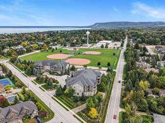 Experience luxury living in this stunning aerial view of a modern residential complex.