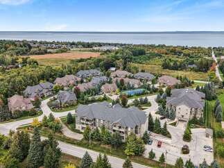 Discover this stunning property offering a blend of modern living and natural beauty, with spacious homes nestled amongst mature trees and overlooking a serene body of water.