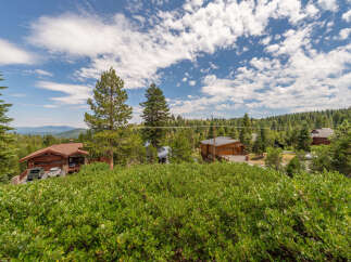 Nestled amidst a lush green landscape, this property offers a serene mountain retreat.