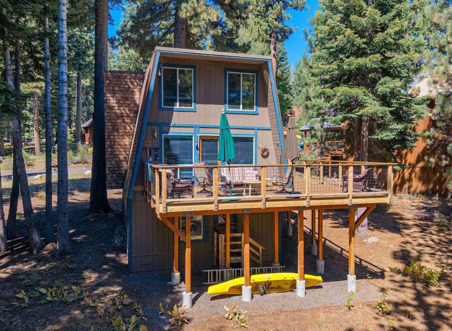 Experience the ultimate mountain getaway in this charming A-frame cabin nestled among tall pine trees.