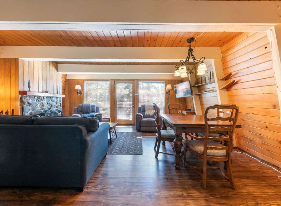Experience cozy living in this charming cabin-style living and dining area.