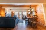 Experience cozy living in this charming cabin-style living and dining area.