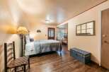 This charming room offers a comfortable queen-size bed with a cozy quilted comforter, perfect for a restful night's sleep.